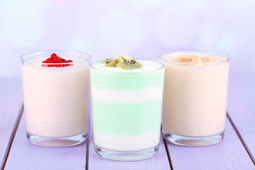 Delicious yogurt with fruits tastes in glasses and fresh fruits