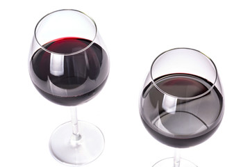 Glasses of red wine isolated on white background