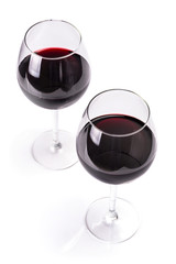 Glasses of red wine isolated on white background