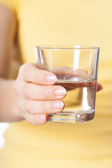 Woman holding a glass of water