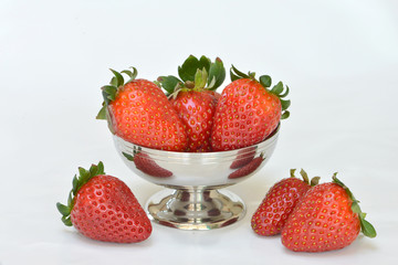 Silver cup filled with whole strawberries