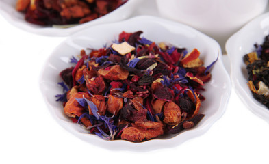 Aromatic dry tea in bowls close up