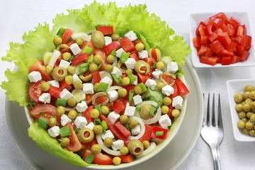 Vegetable salad with tomatoes, peppers and goat cheese.