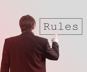 Businessman Using Touch Screen Rules