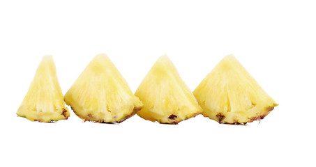 Quarters of slices pineapple in a row.