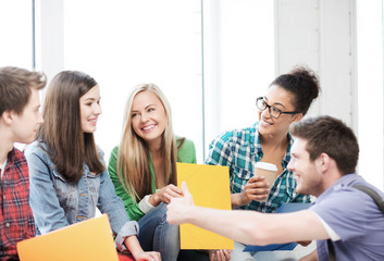 students communicating and laughing at school