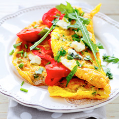 breakfast with fried eggs and vegetables