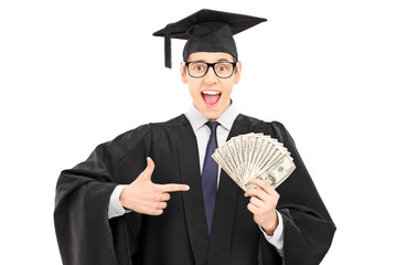 Male student holding cash and pointing with finger