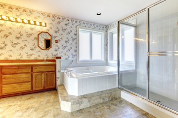 Floral bathroom  with white tub and shower