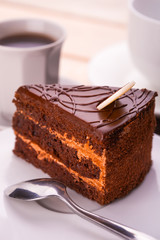 delicious chocolate cake and cup of coffee