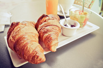Breakfast with coffee and croissants