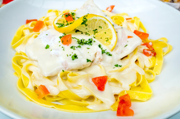 close-up of plate of pasta and smoked salmon