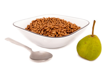 chocolate cereal breakfast on a bowl witha pear