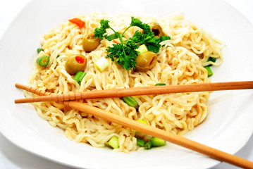 Chopsticks on Noodles and Vegetables