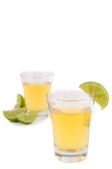 Gold tequila shot with lemon