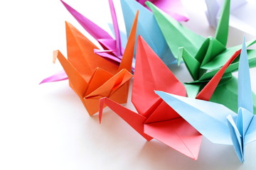 colorful paper origami birds on a white background