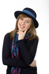 Smiling beautiful teenage girl with navy hat