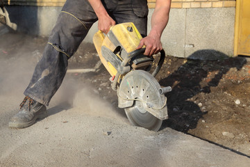Construction site, asphalt or concrete cutting with saw blade