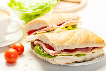 Panini sandwich with ham, cheese and tomato