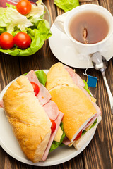 Panini sandwich with ham, cheese and tomato