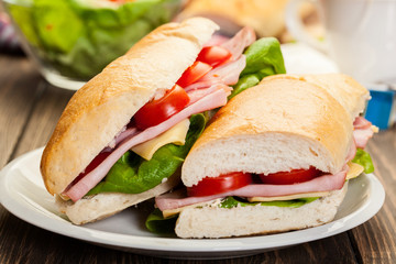 Italian panini sandwich with ham, cheese and tomato