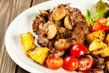 Fried pork chop with mushrooms