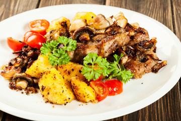 Fried pork chop with mushrooms