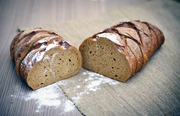 Fresh Tasty Bread on Woody Background