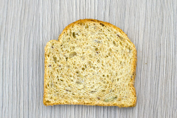 Fresh Tasty Bread on Woody Background