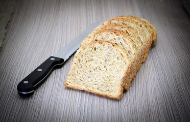 Fresh Tasty Bread on Woody Background