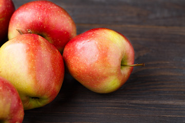 Fototapeta na wymiar Red apples on wooden table