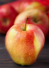 Red apples on wooden table