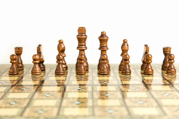 Chessboard, strategy game with 16 pieces in focus
