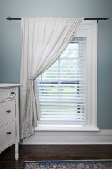 Window with blinds and curtain