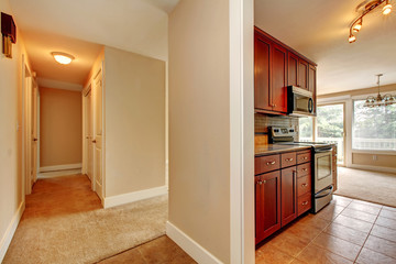 View of narrow corridor and kitchen room