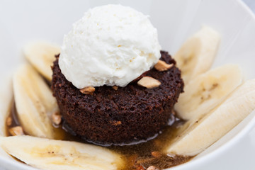Chocolate brownie with bananas and whipped cream