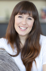 Woman Smiling At The Camera At Home