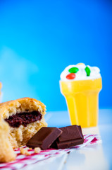 Delicious homemade muffins on blue background