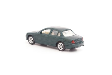 miniature green toy car on white background