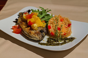 Image of tasty fish with rise and vegetables