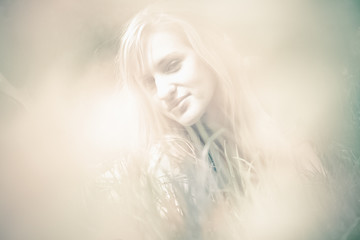 Toned blurred portrait of beautiful blonde woman