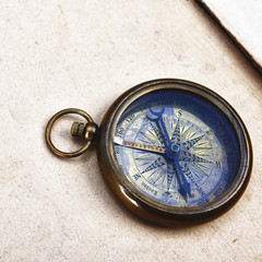 Fototapeta na wymiar compass on old paper