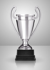 champion silver trophy over grey background