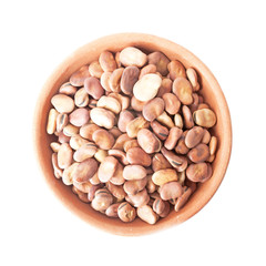 Broad beans in bowl of clay isolated over white