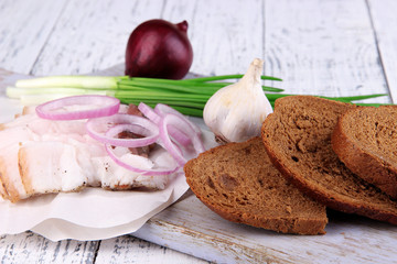Slices of bread and lard with onion