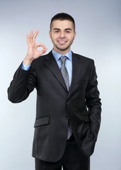 Business man on grey background