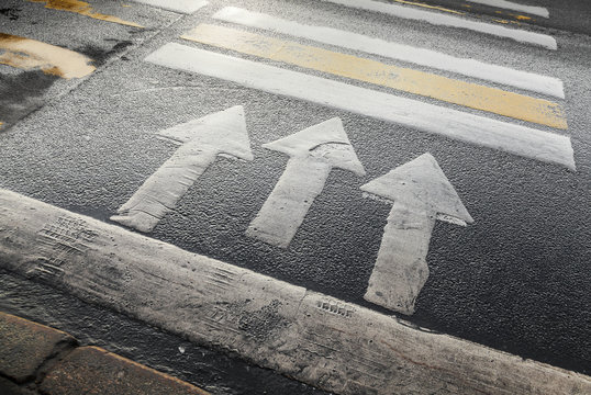 Pedestrian Crossing Road Marking With Arrows On Asphalt