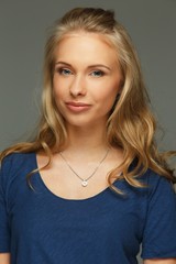 Positive young woman with long hair and blue eyes