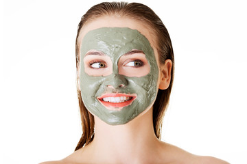 Woman with clay facial mask