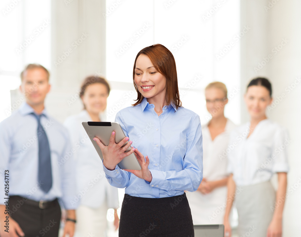 Canvas Prints smiling woman looking at tablet pc at office